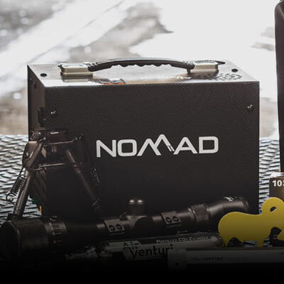 Air Venturi Nomad pcp compressor sitting on a tailgate