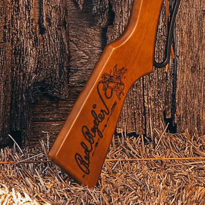 Closeup of Red Ryder s engraved stock