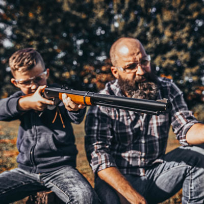 Dad and son shooting Red Ryders together